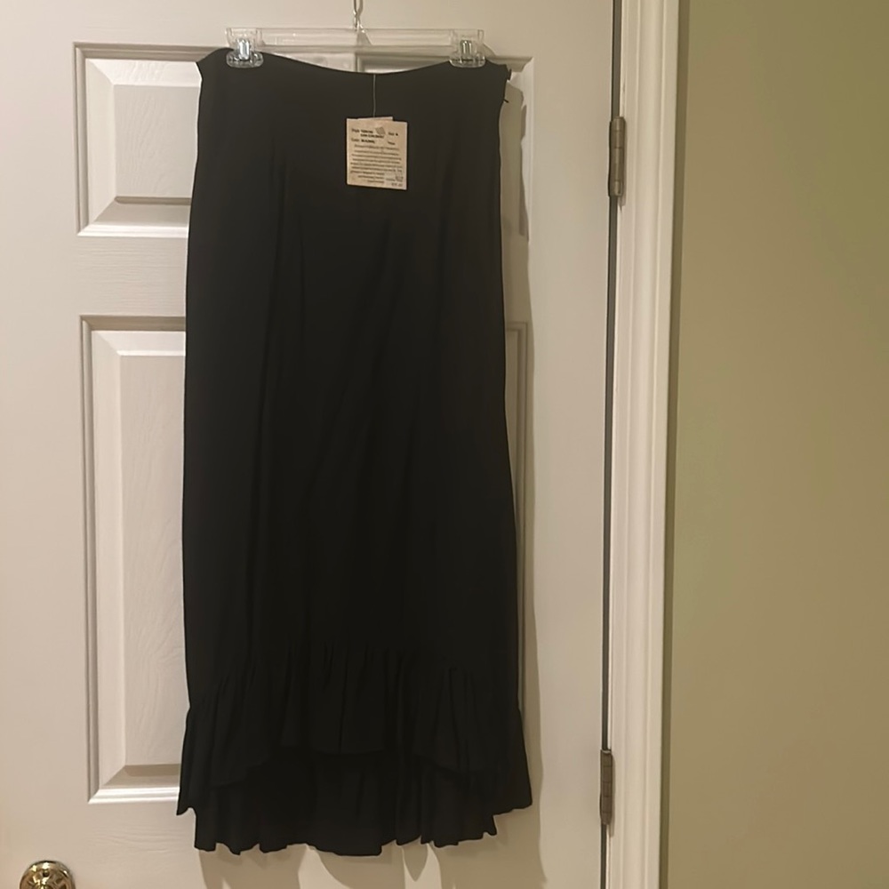 Brand new with tags, never worn black maxi ruffled 100%rayon skirt. Hand wash.